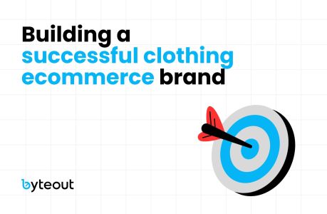 Blog cover image with the text 'Building a successful clothing ecommerce brand' and the Byteout logo. A bullseye target with an arrow hitting the center symbolizes hitting business goals.